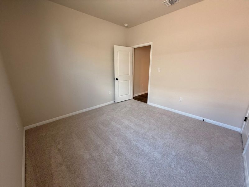 Spacious, unfurnished interior of a new home in The Colony, Bastrop (Image 6).