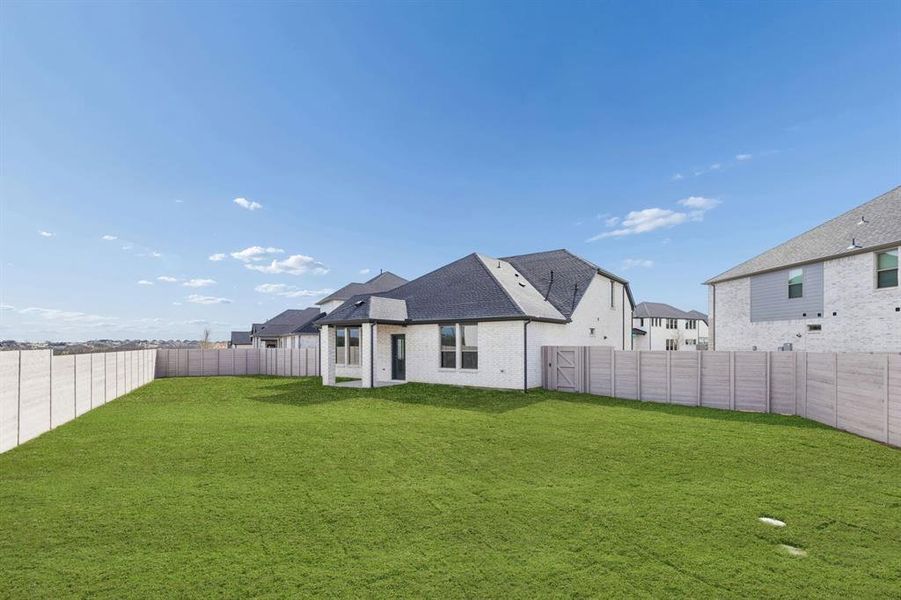Covered Patio in the Stanley II home plan by Trophy Signature Homes – REPRESENTATIVE PHOTO