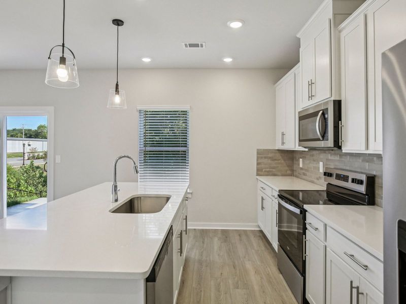 Prep dinner in the kitchen without missing the conversation in the great room.