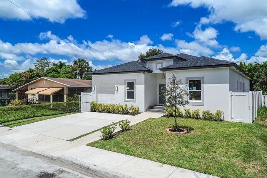 Front exterior of a new home in , Fort Lauderdale, FL, highlighting curb appeal (Image 17). Front exterior of a new home in , Fort Lauderdale, FL, highlighting curb appeal (Image 17).