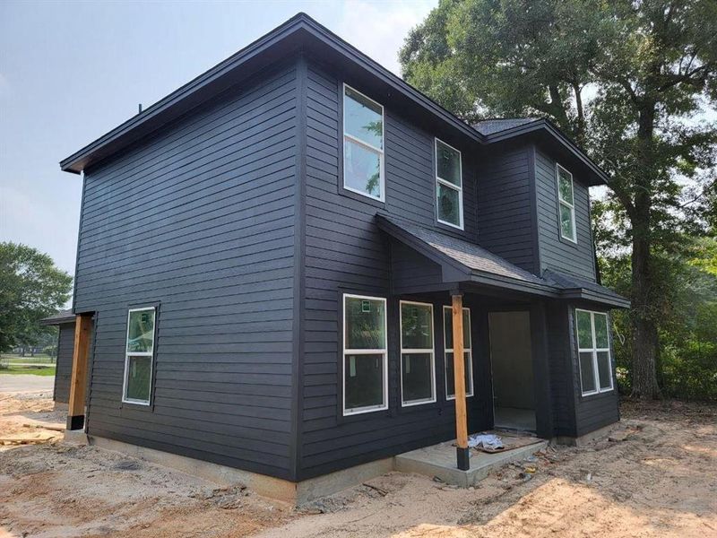 Another view of the back of the home. Sod/grass will be installed when the home is complete.