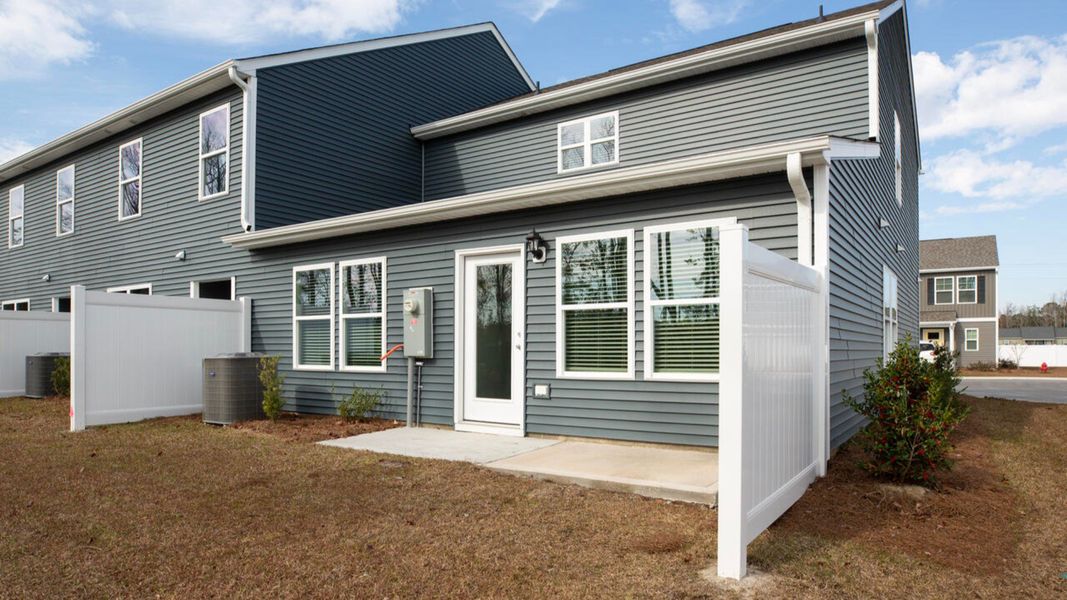 Exterior details and patio area of a home in Waterside Townhomes, Surf City (Image 2).