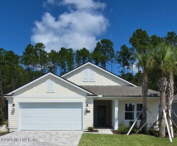 Front exterior of a new home in Sawmill Branch Express, Palm Coast, FL, highlighting curb appeal (Image 20).