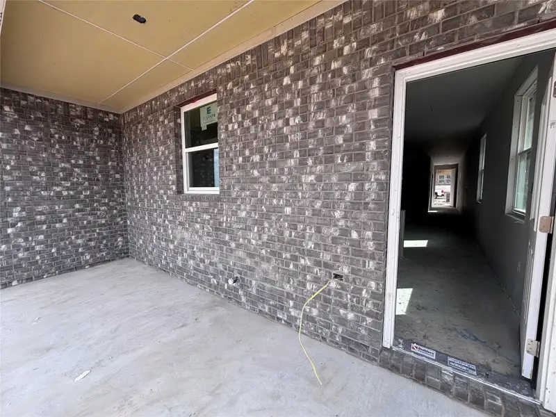 Exterior details and patio area of a home in The Colony, Bastrop (Image 6).