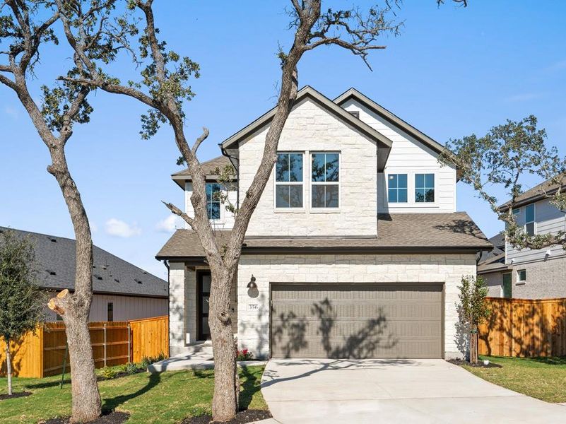 Front exterior of a new home in Terrace Collection at Heritage, Dripping Springs, TX, highlighting curb appeal (Image 2). Front exterior of a new home in Terrace Collection at Heritage, Dripping Springs, TX, highlighting curb appeal (Image 2).