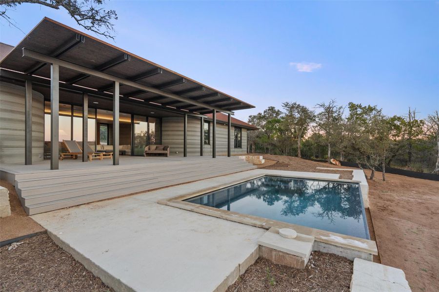 Swimming pool/hot tub featuring a patio