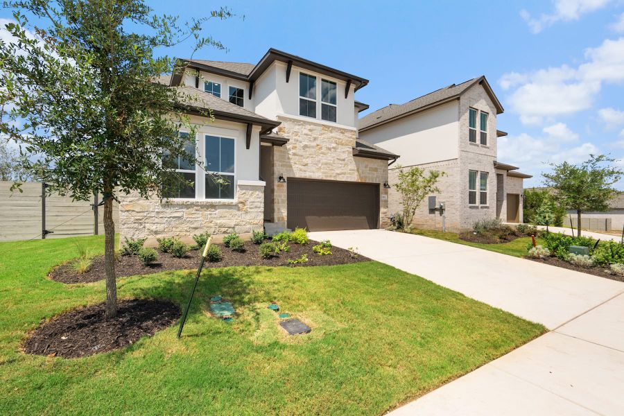 Front exterior of a new home in Wolf Ranch, Georgetown, TX, highlighting curb appeal (Image 23).