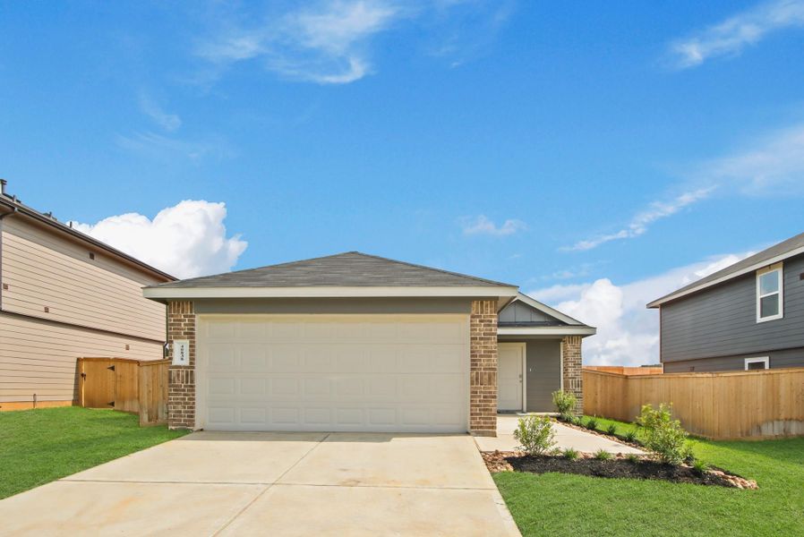 Front exterior of a new home in Mill Creek, Magnolia, TX, highlighting curb appeal (Image 2). Front exterior of a new home in Mill Creek, Magnolia, TX, highlighting curb appeal (Image 2).