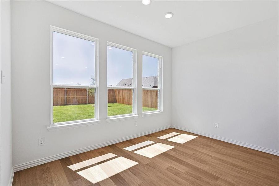 Spare room with hardwood / wood-style floors