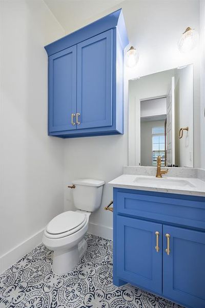 Bathroom with vanity and light tile patterned floors