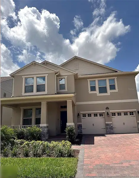 Front exterior of a new home in , Winter Garden, FL, highlighting curb appeal (Image 1). Front exterior of a new home in , Winter Garden, FL, highlighting curb appeal (Image 1).