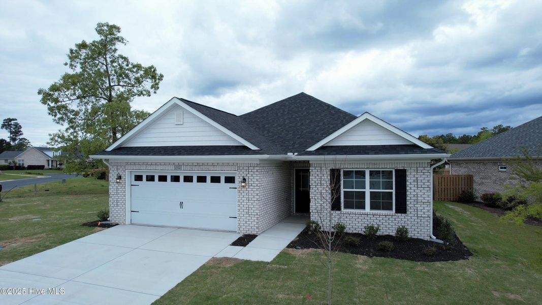 Front exterior of a new home in Palmetto Creek, Bolivia, NC, highlighting curb appeal (Image 2). Front exterior of a new home in Palmetto Creek, Bolivia, NC, highlighting curb appeal (Image 2).