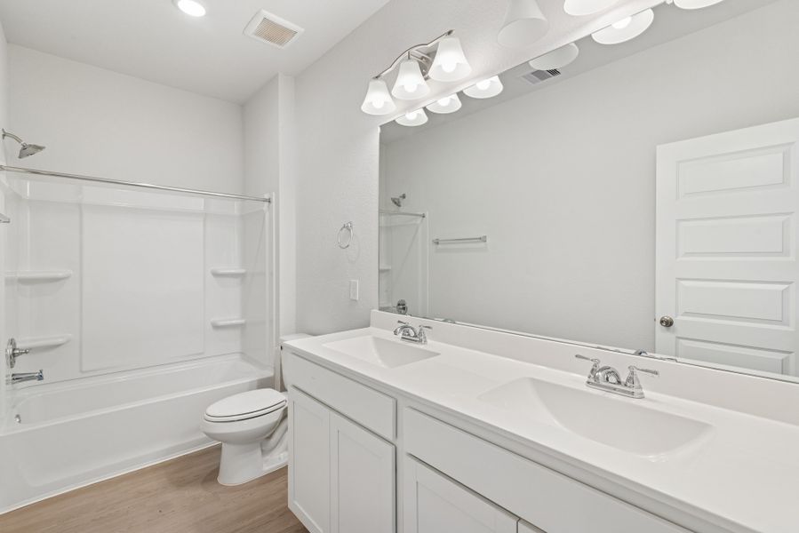The Oriole II- Hall Bath with Dual Vanities. Sample image to be used for example only, colors, options and upgrades vary.