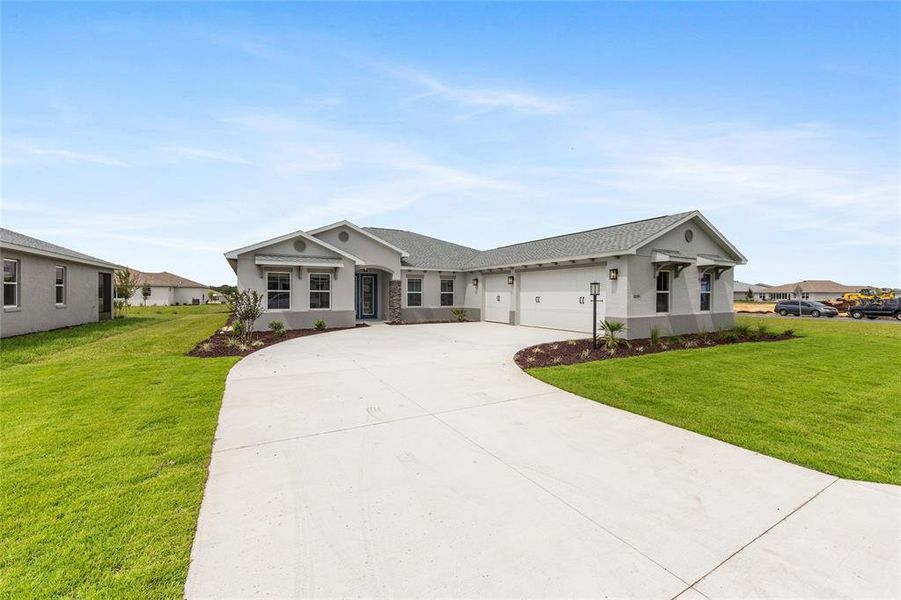 Front exterior of a new home in On Top of the World Communities, Ocala, FL, highlighting curb appeal (Image 23).