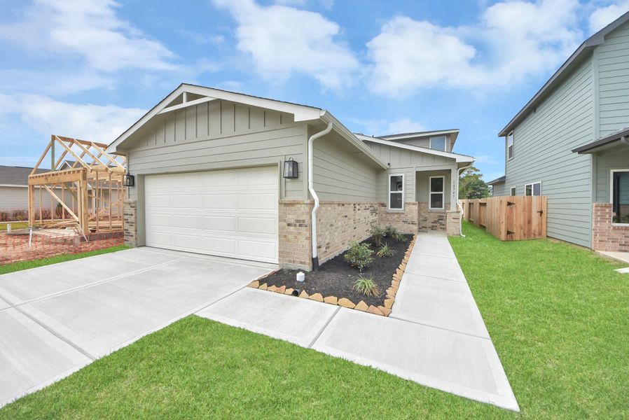 Front exterior of a new home in The Enclave at Spring Branch, Conroe, TX, highlighting curb appeal (Image 25).