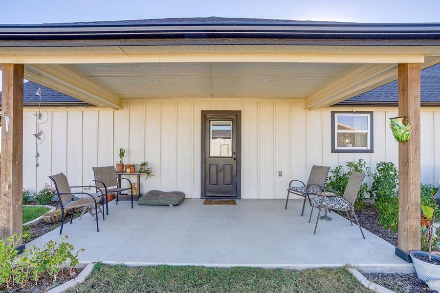 Upgraded back covered patio with fiber cement siding with plenty of room for entertaining Upgraded back covered patio with fiber cement siding with plenty of room for entertaining
