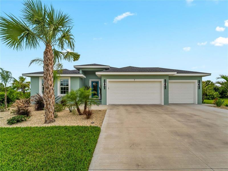 Front exterior of a new home in , Placida, FL, highlighting curb appeal (Image 21).