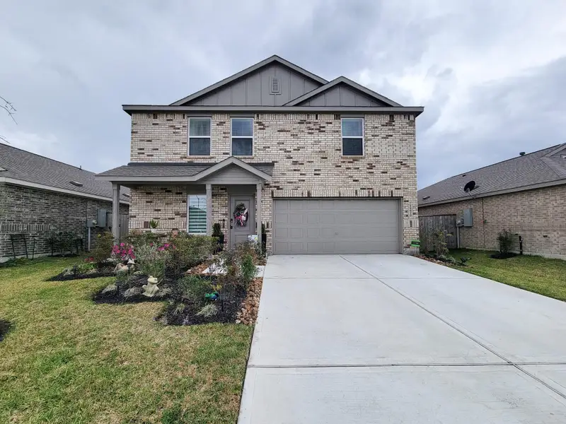 Front exterior of a new home in Tavola, New Caney, TX, highlighting curb appeal (Image 21).