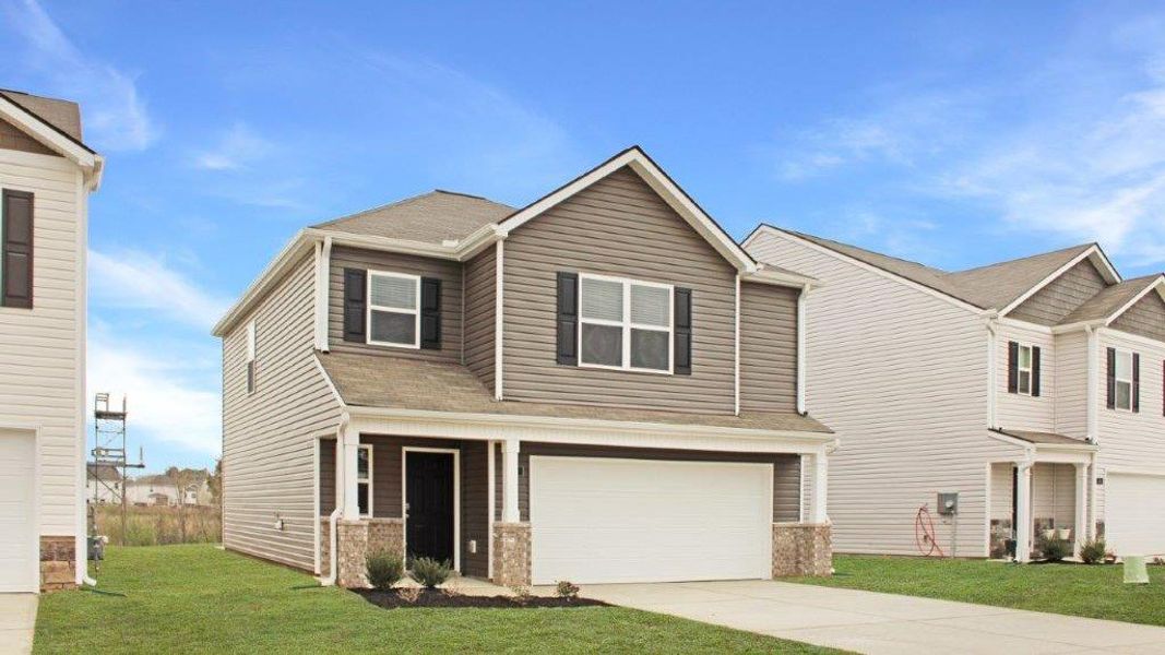 Front exterior of a new home in Hawk's Ridge, Rossville, GA, highlighting curb appeal (Image 2).