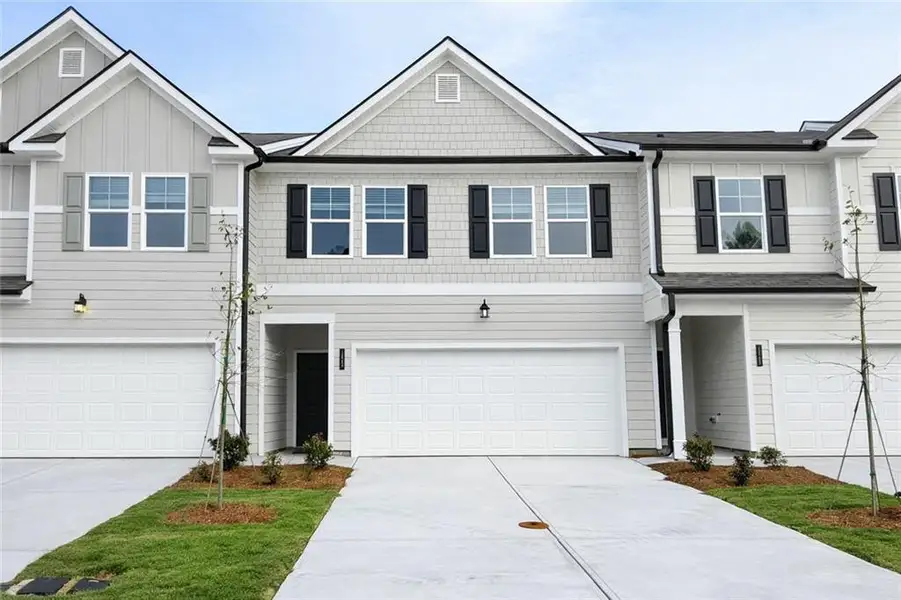 Front exterior of a new home in Rivershire Place, Villa Rica, GA, highlighting curb appeal (Image 1). Front exterior of a new home in Rivershire Place, Villa Rica, GA, highlighting curb appeal (Image 1).