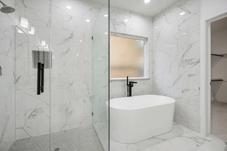 Primary retreat with luxurious soaking tub.