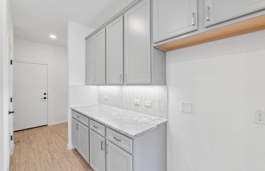 Furnished interior view inside a new home in Bluffview Reserve, Leander (Image 10).