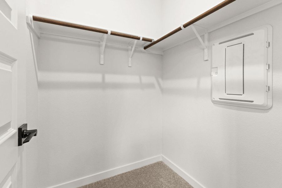Streamlined closet system with ample hanging space for effortless organization.