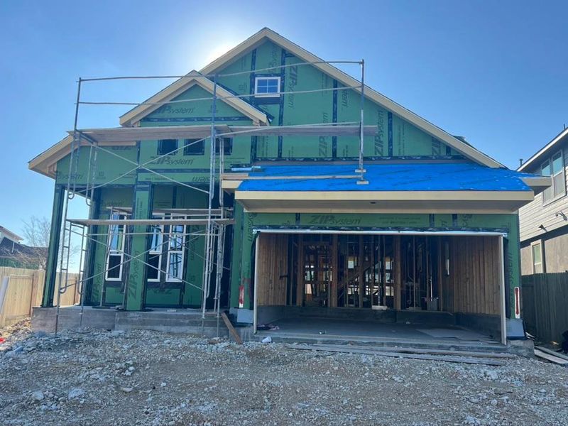 Property in mid-construction with a garage