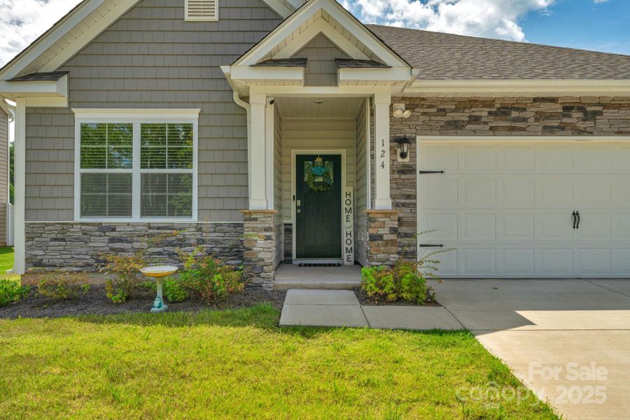Front exterior of a new home in Crossroads, Locust, NC, highlighting curb appeal (Image 19). Front exterior of a new home in Crossroads, Locust, NC, highlighting curb appeal (Image 19).