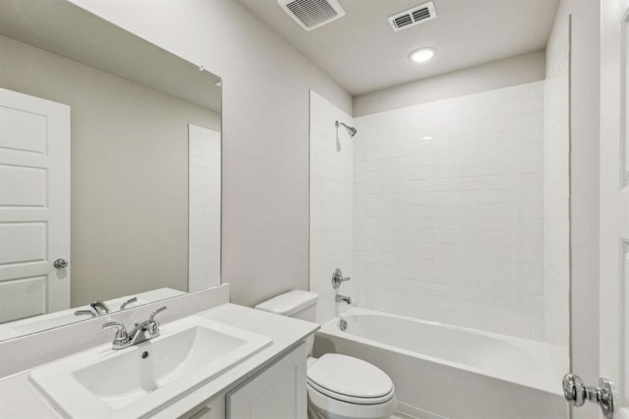 Bathroom in the Harper home plan by Trophy Signature Homes – REPRESENTATIVE PHOTO