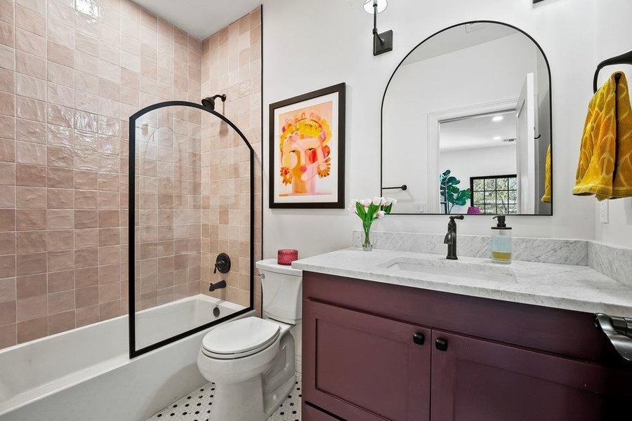 Full bathroom featuring vanity, shower / bath combination, and recessed lighting