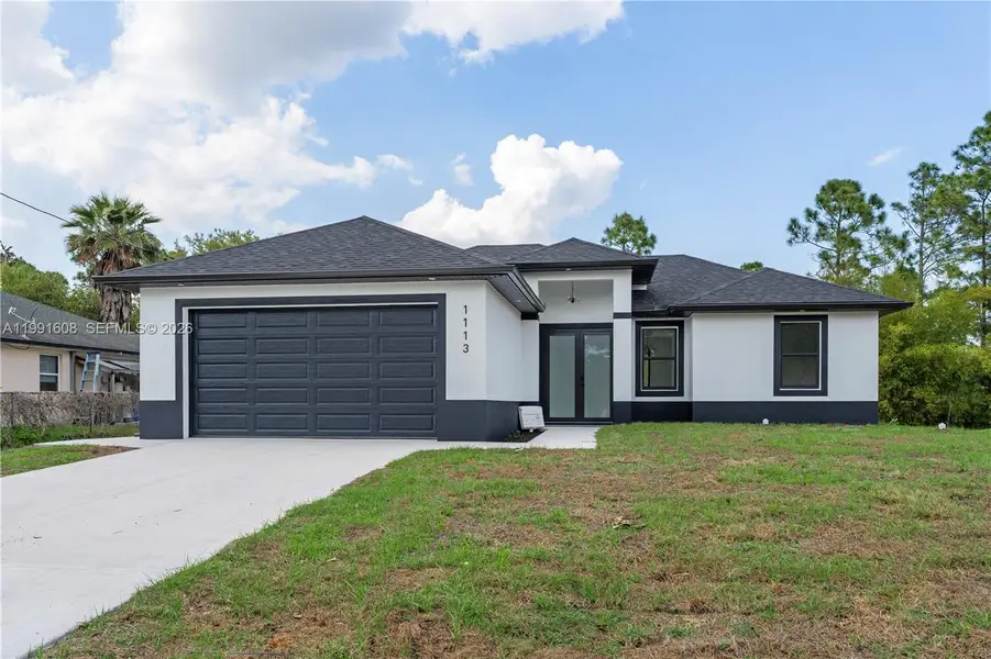 Front exterior of a new home in , Lehigh Acres, FL, highlighting curb appeal (Image 30). Front exterior of a new home in , Lehigh Acres, FL, highlighting curb appeal (Image 30).