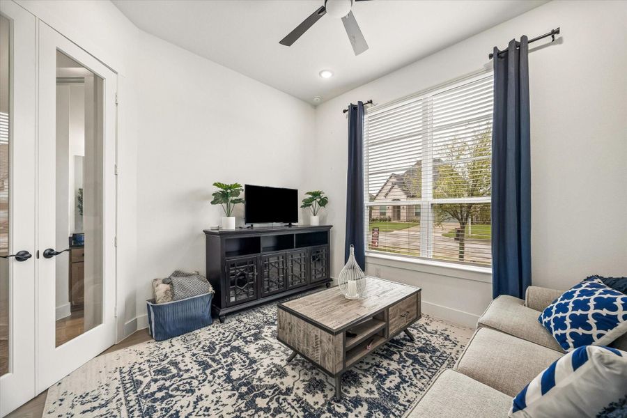 YOUR DEDICATED HOME OFFICE OR FORMAL LIVING SPACE IS AT THE FRONT OF THE HOME WITH GLASS FRENCH DOORS