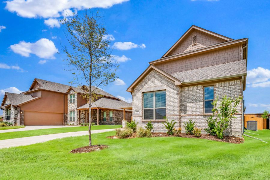 Front exterior of a new home in Summerwood, Red Oak, TX, highlighting curb appeal (Image 26). Front exterior of a new home in Summerwood, Red Oak, TX, highlighting curb appeal (Image 26).