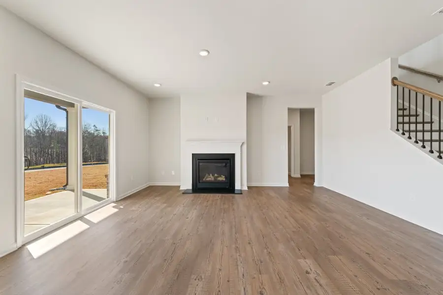 A large white room with a fireplace. A large white room with a fireplace.