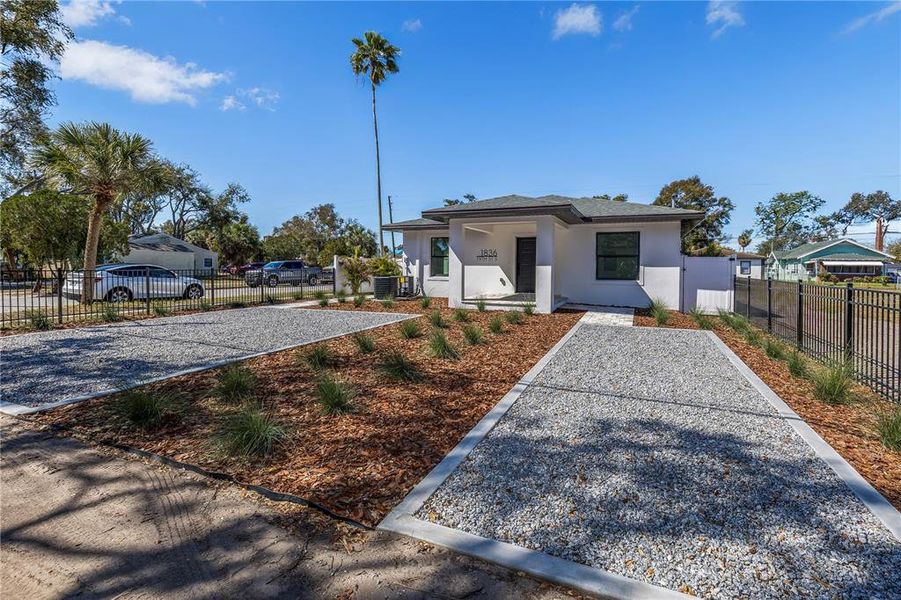 Front exterior of a new home in , St. Petersburg, FL, highlighting curb appeal (Image 25). Front exterior of a new home in , St. Petersburg, FL, highlighting curb appeal (Image 25).