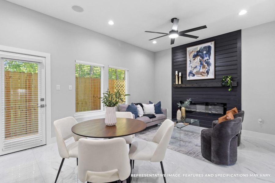 From your dining area, you love the way the fireplace wall anchors the room—every meal feels cozy with that modern focal point nearby.