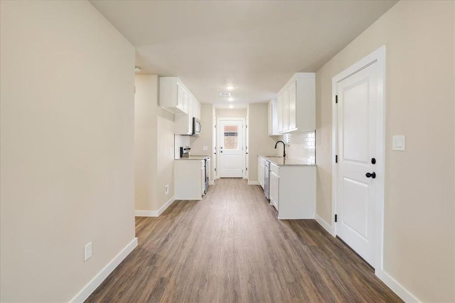 Spacious, unfurnished interior of a new home in Miller Street Cottages, Denison (Image 23).