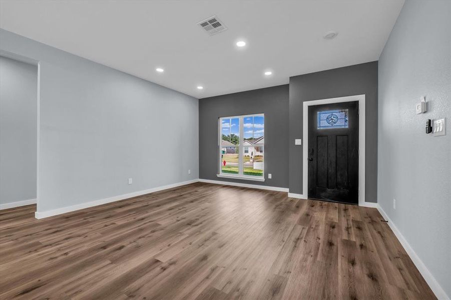 Entrance foyer featuring wood finished floors and recessed lighting Entrance foyer featuring wood finished floors and recessed lighting