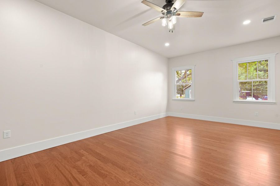 Hardwood floors and a ceiling fan create a comfortable and stylish retreat. Hardwood floors and a ceiling fan create a comfortable and stylish retreat.