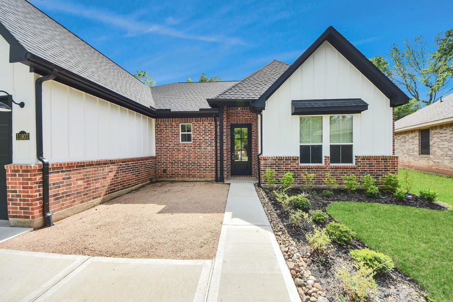 Charming entryway with covered porch and welcoming design.