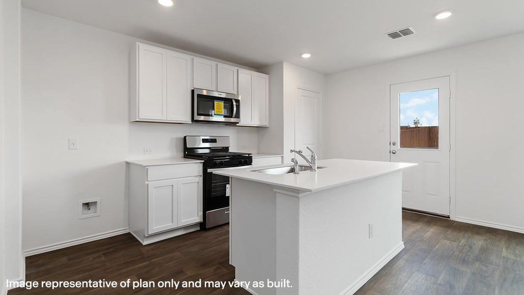 Kitchen with stainless steel appliances, white cabinetry, recessed lighting, a center island with sink, and dark wood-style floors