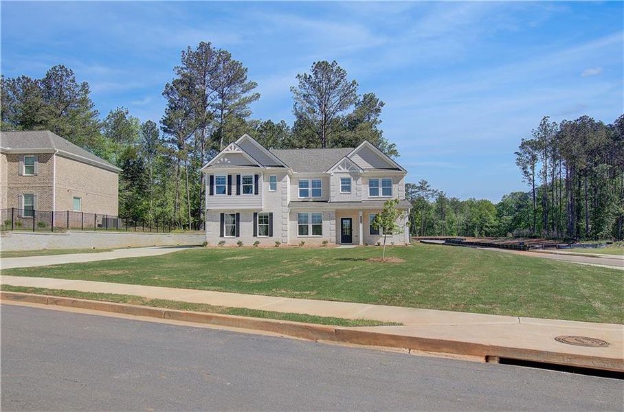 Front exterior of a new home in Trinity Park, McDonough, GA, highlighting curb appeal (Image 21).