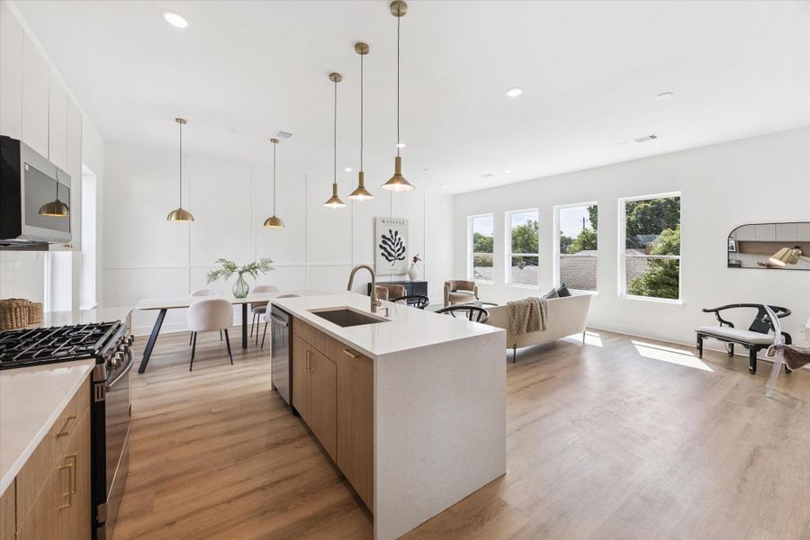 The sleek, modern cabinetry is consistent throughout the home. Clean lines and thoughtful touches like the decorative molding on the far wall elevate the space. The sleek, modern cabinetry is consistent throughout the home. Clean lines and thoughtful touches like the decorative molding on the far wall elevate the space.