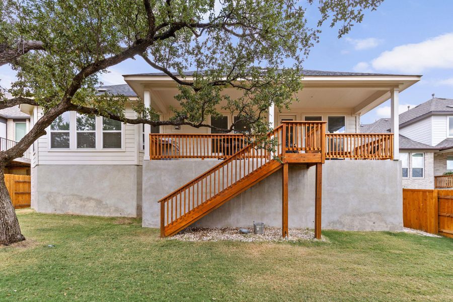 Rear view of property with stairway