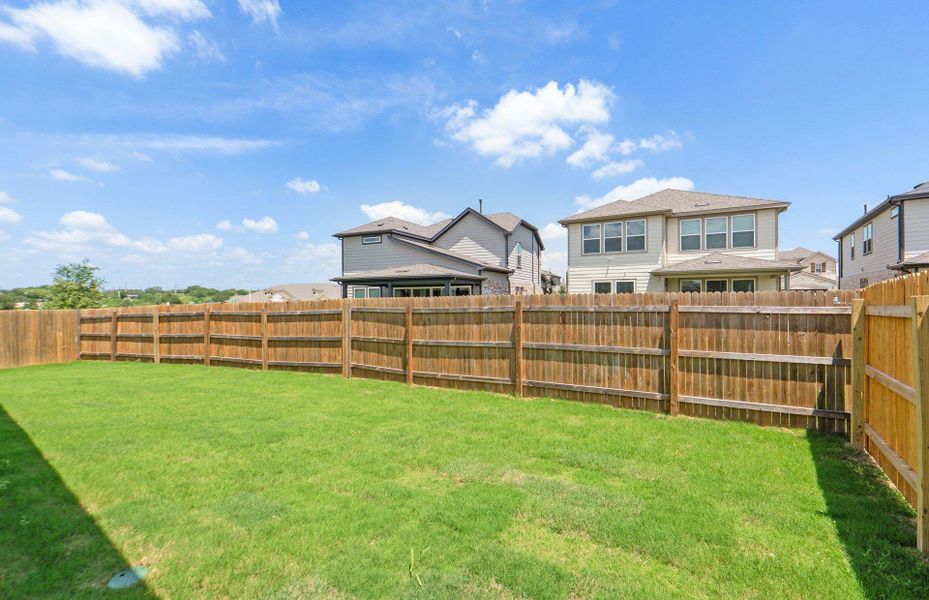 Exterior details and patio area of a home in Crosswinds, Kyle (Image 19).