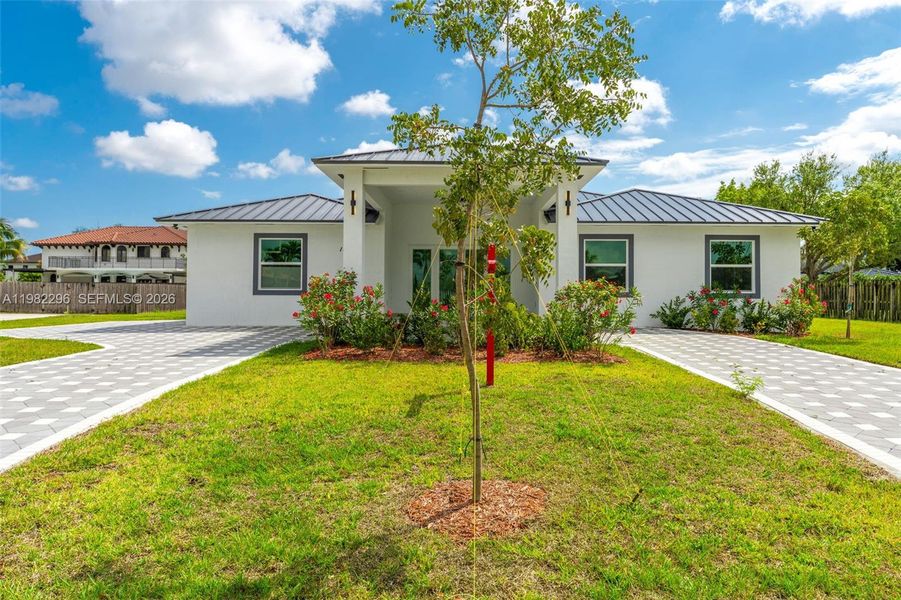 Front exterior of a new home in , Miami, FL, highlighting curb appeal (Image 1). Front exterior of a new home in , Miami, FL, highlighting curb appeal (Image 1).