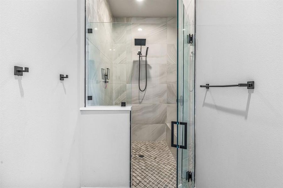 Full bathroom featuring a marble finish shower