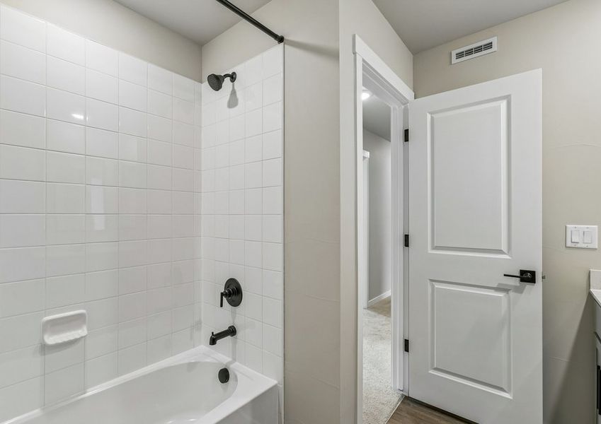 The secondary bathroom has a tub/shower combo.