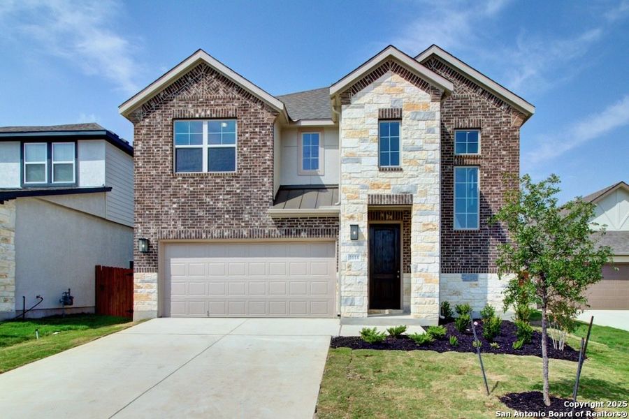 Front exterior of a new home in Stream Waters, Seguin, TX, highlighting curb appeal (Image 1).